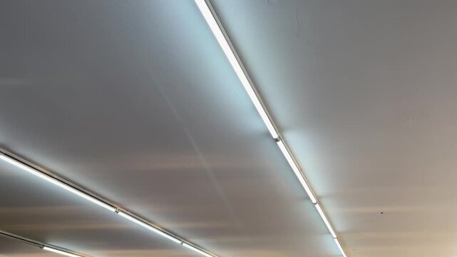 Low angle of modern parallel linear LED lights on ceiling