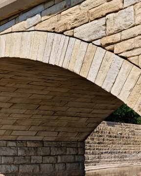 Detailed stone arch and masonry close-up showing textured blocks and joints for architecture background, design and poster use
