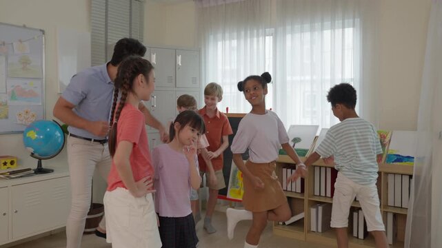 Teacher guides diverse children through joyful classroom teamwork with artwork, book, globe, bright window light, active learning games, and creative school activities for every student