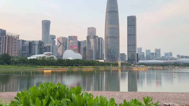 SHENZHEN, CHINA &ndash; AUGUST , 2026: Modern skyscrapers and city streets in the background at sunset in Shenzhen, China.