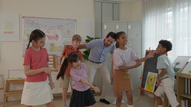 Teacher Guiding Diverse Children and Students in Classroom Education Activity, Smiling Group Sharing Creative Movement, Artwork, Teamwork, and Joyful Learning Moment