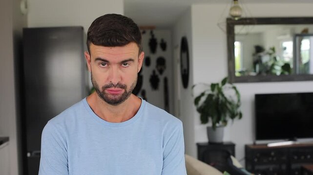 Anxious man listening with worried expression and swallowing nervously