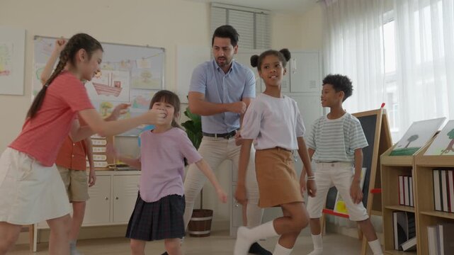 Children Teacher Classroom Dancing Joyful Movement Teamwork Creative Learning School Activity with Diverse Group Expressive Adult Guidance and Engaging Collaborative Educational Energy