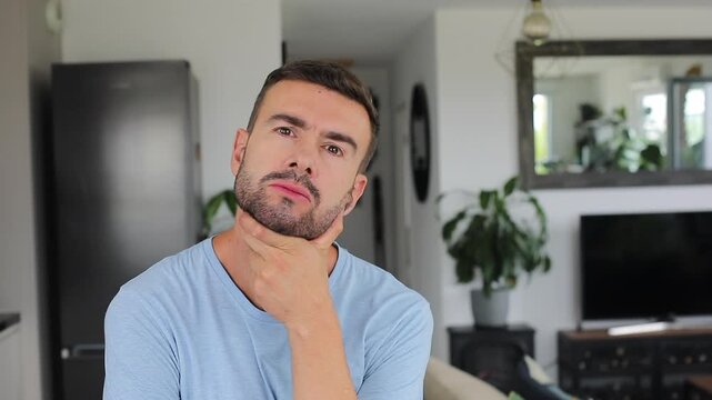 Suspicious man listening carefully before moving head with agreement vibes.
