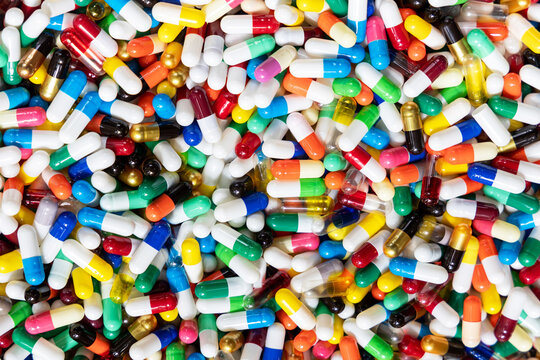 Full frame close-up background of multicolored medical Capsules, Pharmacy and Healthcare Concept.