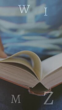 Animation of letters over african american schoolchild reading book