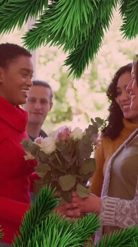 Animation of christmas decorations over diverse friends smiling