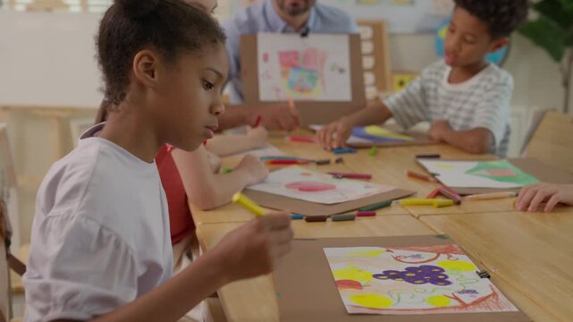 Children Classroom Art Painting Drawing Creativity Diverse Student Teacher Education Creative Lesson Colorful Artwork Wooden Table Elementary Learning Multicultural Classroom Girl with Pencil Child