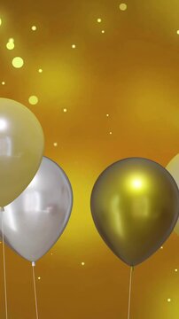 Animation of gold and silver balloons with party streamers on yellow background