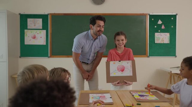 Teacher Guiding Student Classroom Artwork Drawing Activity with Children Learning Education School Table, Collaborative Creative Art Lesson Displaying Colorful Paintings and Supportive Classroom