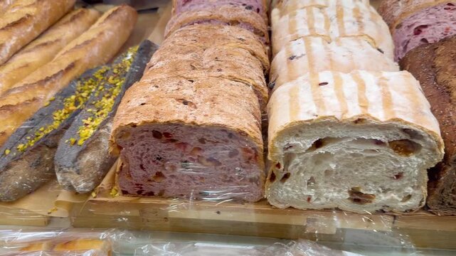 Fresh Bread Varieties on Supermarket Shelf.Whole Wheat, White, Rye, Sourdough and Multigrain Bakery Display