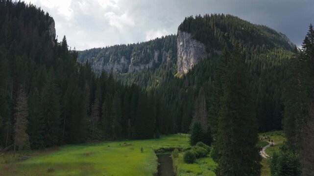 Tourists Walking Through Zanoaga Gorge in Romania