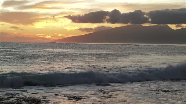 Tahiti golden hour sunset Teahupo'o surf waves crashing on shallow coral reef lagoon aerial drone French Polynesia Mount Orohena South Pacific Ocean island Passe Havea harbor view landscape static