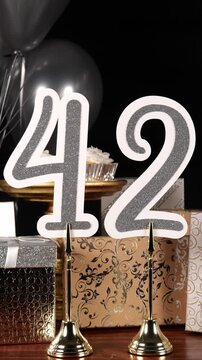 Silver Number 42 with Silver Glitter Sparkles with Gifts and Balloons and Cupcakes for Party Forty Two