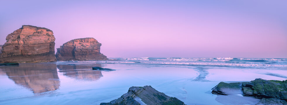 Seascape in the morning. Rocky sea coast at sunrise. Beach Playa de Las Catedrales in Ribadeo, Galicia, Spain, Europe