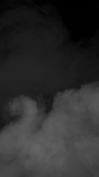 Animation of gray smoke trails and clouds on black background