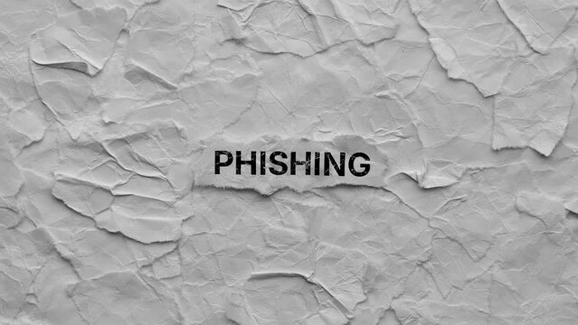 Crumpled piece of paper with word Phishing on torn crumpled white paper pieces background