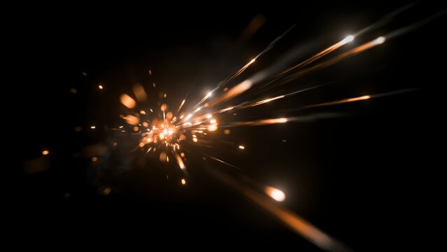 Golden sparks and light streaks radiating on a black background