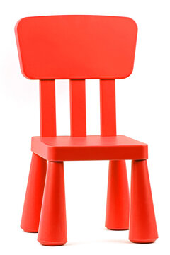 Red plastic chair on a white background