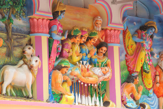 Stone wall relief carving depicting the Mahabharata scene of Bhishma lying on a bed of arrows with Krishna and Pandavas.