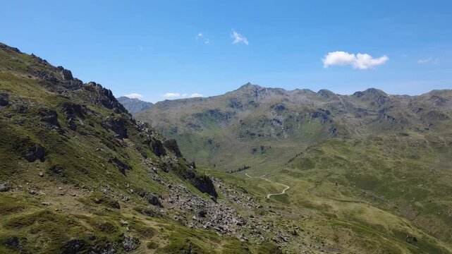 Aerial Drone Shot of Green Austrian Alps in Summer with Clear Blue Sky