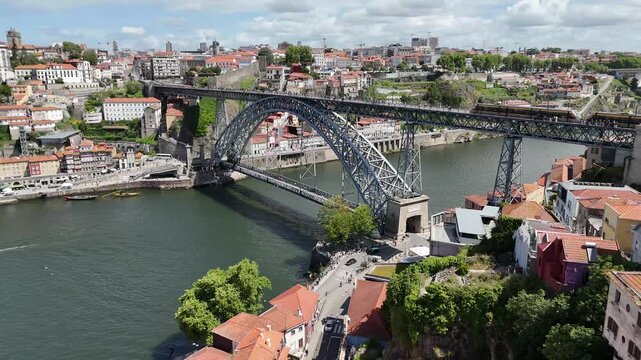 Urban development and infrastructure in Porto Portugal aerial view of Dom Lu&iacute;s i bridge over Douro river with city skyline cityscape drone