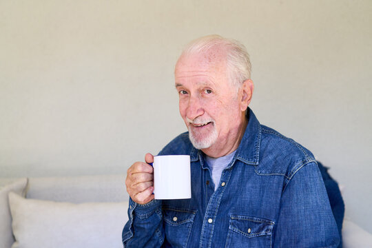 Senior man enjoying a hot drink at home, healthy aging and independent living, wellness and comfort in retirement
