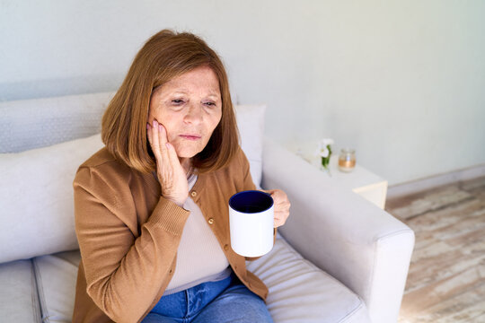 Elderly woman with toothache or jaw pain, senior health and dental care, discomfort and need for home healthcare