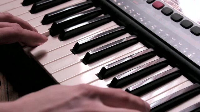 Close-Up Of Person Playing Keyboard