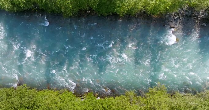 Top down view of fast moving mountain river. Nature of Canada 