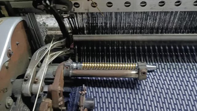 Close Up View of an Old Vintage weaving Machine with Antique Metal Details and Retro Industrial Technology