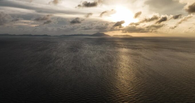 Sunset over the sea and islands in the tropics. Weh Island. Indonesia.