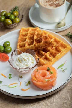 Crunchy waffle fries with sour cream dip served in a basket