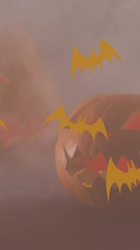 Animation of bats icons over halloween pumpkins