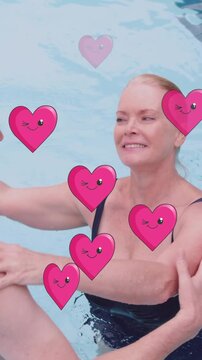 Animation of heart icons over caucasian senior couple dancing in pool