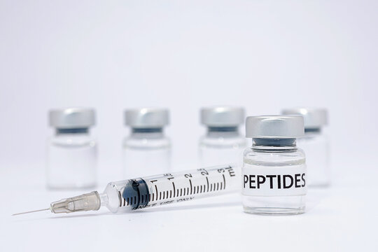 Medical peptide therapy vial with syringe offering hope for advanced healthcare treatment on clean white background