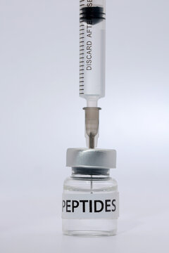 Medical syringe drawing peptide liquid vial serious clinical health care treatment science laboratory injection dose medication sterile research
