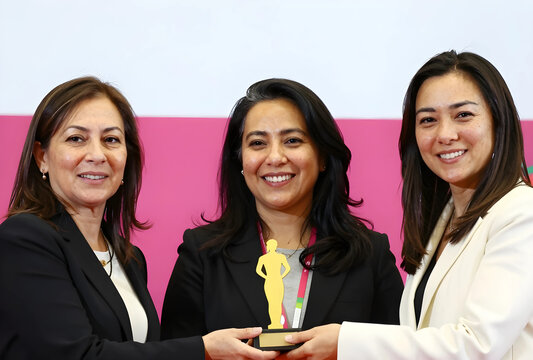 Women in leadership and business achievement, diverse group of female executives receiving an award for success and recognition