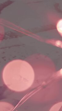 Animation of glowing fairy lights over winter scenery