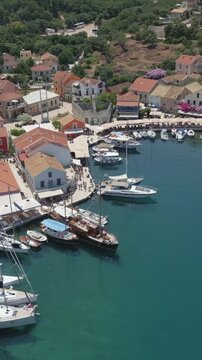 Vertical Aerial View of Fiskardo Village Port and Boats in Kefalonia Greece