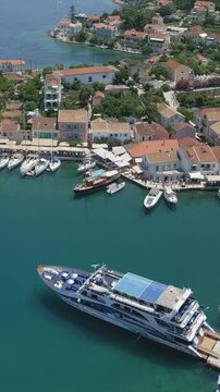 Vertical Aerial View of Fiskardo Village Port and Boats in Kefalonia Greece