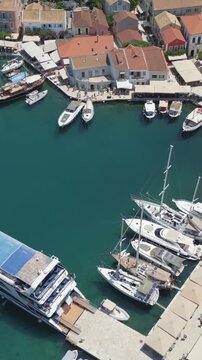 Vertical Aerial View of Fiskardo Village Port and Boats in Kefalonia Greece