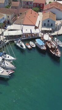 Vertical Aerial View of Fiskardo Village Port and Boats in Kefalonia Greece