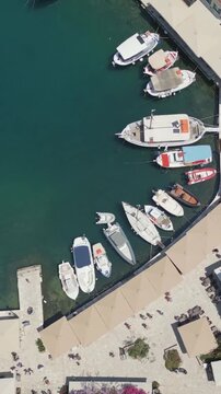 Vertical Aerial View of Fiskardo Village Port and Boats in Kefalonia Greece