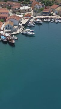 Vertical Aerial View of Fiskardo Village Port and Boats in Kefalonia Greece