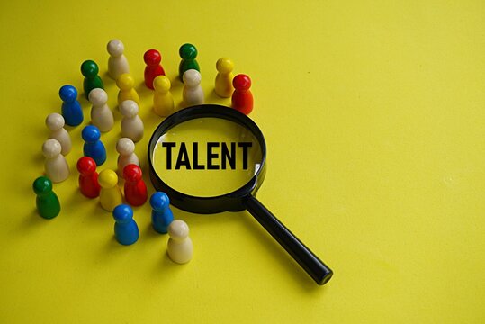 TALENT. Human resources concept. Talented employee needs. Search for capable staff. Wooden pegs background with worker figures