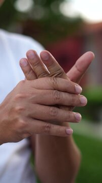 Closeup man holds his wrist. hand injury, feeling pain. Health care and medical concept. and those with a family history of degenerative knuckles.	