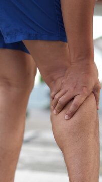 Runner touching painful twisted or broken. Athlete training, running up and down stairs accident. Sport sprained sprain cause injury knee. and pain with leg bones.