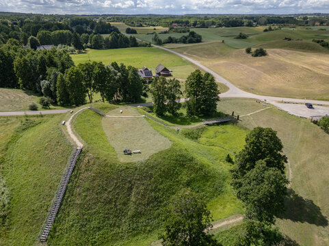 Crone view of Prelomciskes hillfort mound on a shore of Dusia Lake, Lithuania