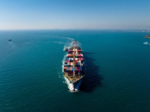 Loaded Cargo Container Ship Navigating Blue Ocean Waters Near Si Racha In Chon Buri Thailand For International Maritime Trade And Freight Logistics